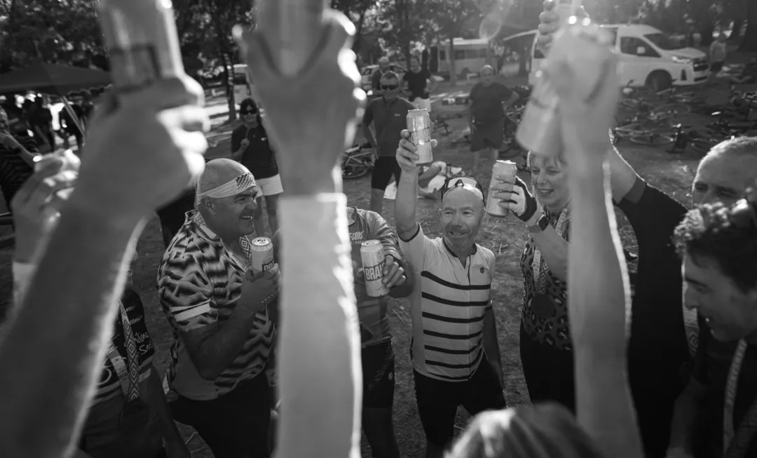 People smiling and celebrating with drinks