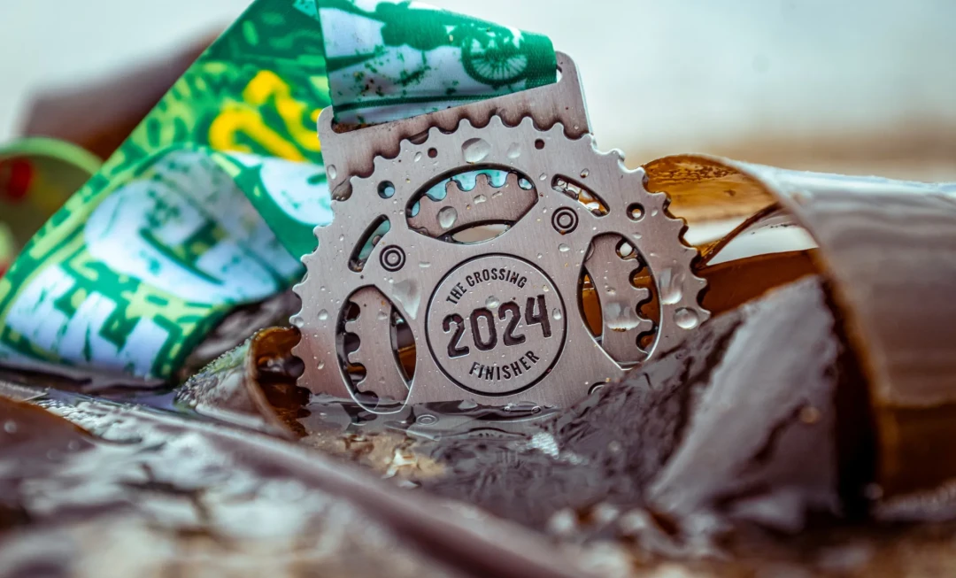 The Crossing 2024 medal in water