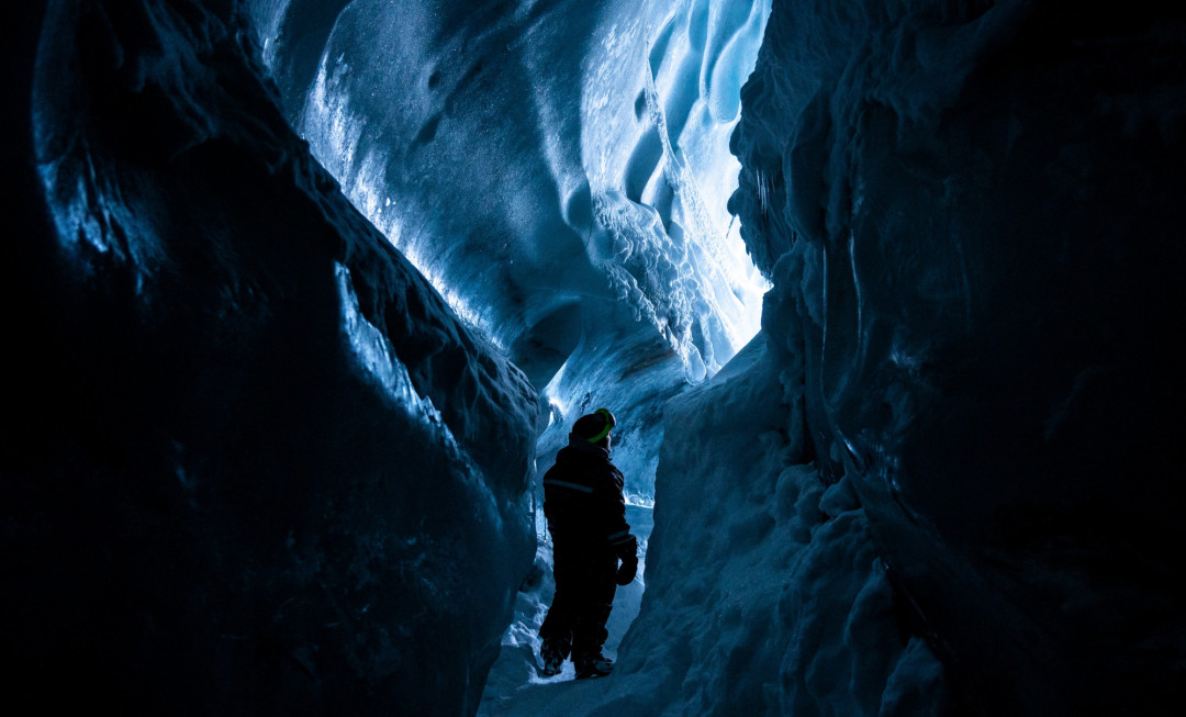 Participant walking through icy cave