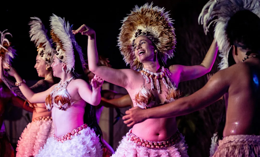Performers wearing head wear and dancing