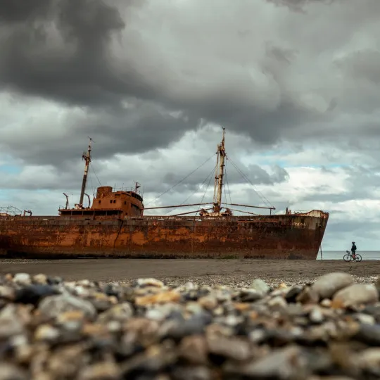 Cyclist stopping to look at shipwreck