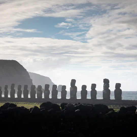Female participant looking out to a line of statues