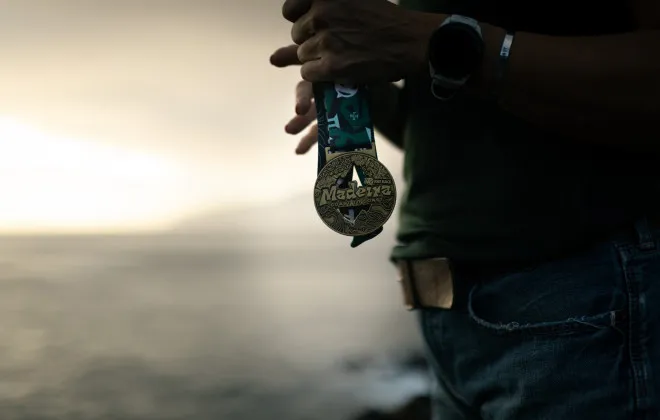 Participant holding a Madeira medal