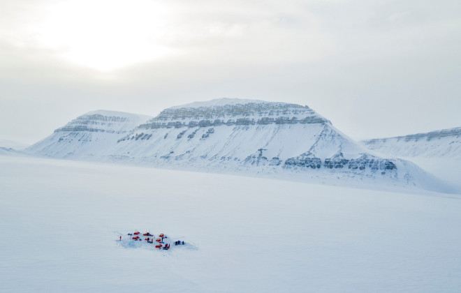 Tents pitched in white snow-covered landscape