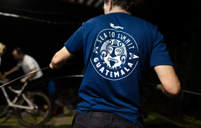 Participant stood with their back to the camera, showing their blue Rat Race Guatemala t-shirt