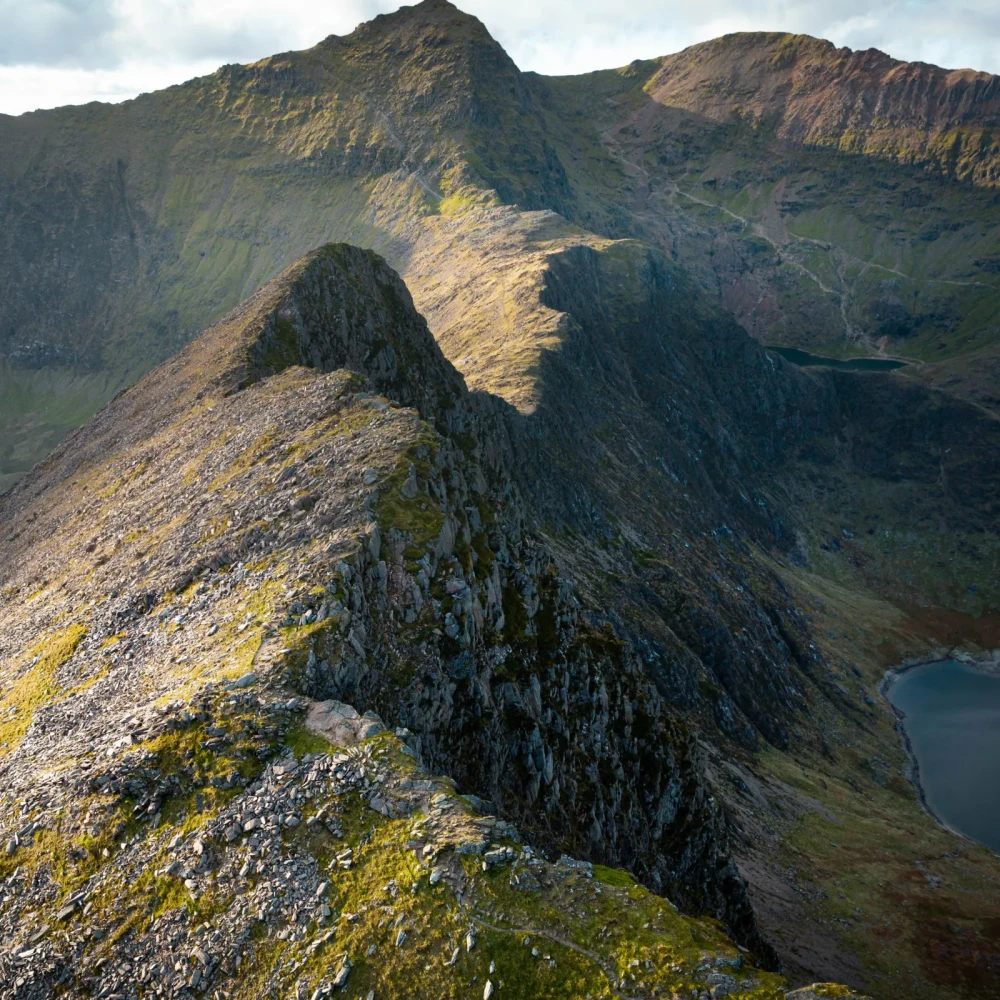 Rocky, mountainous terrain with sparse patches of green