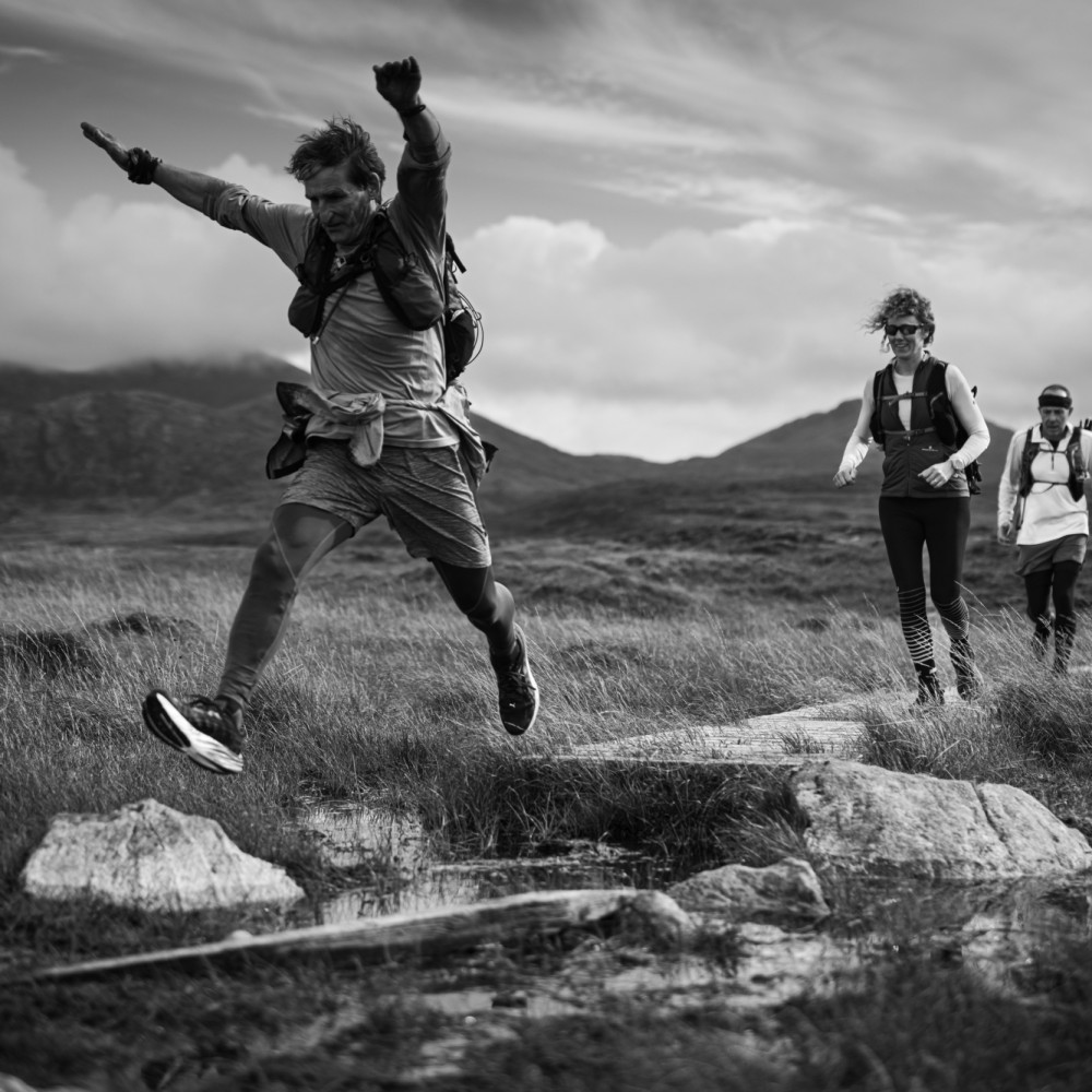 Participants jumping over water