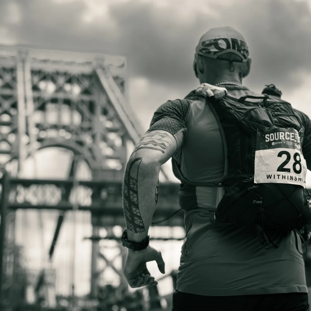 Man running over bridge